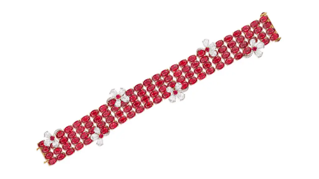This ruby and diamond bracelet features four rows comprising 51.86 carats of oval Burmese rubies with circular rubies and pear-shaped and brilliant-cut diamonds forming floral motifs image
