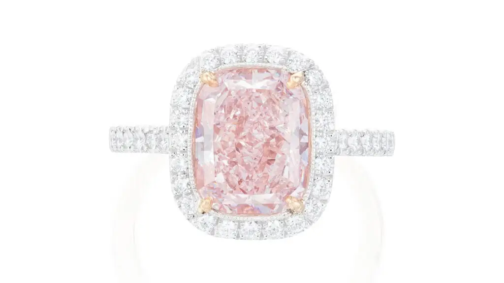 This ring centers a round-cornered rectangular modified brilliant-cut, 4.05-carat, fancy-light-pink diamond in a brilliant-cut diamond surround at Phillips image