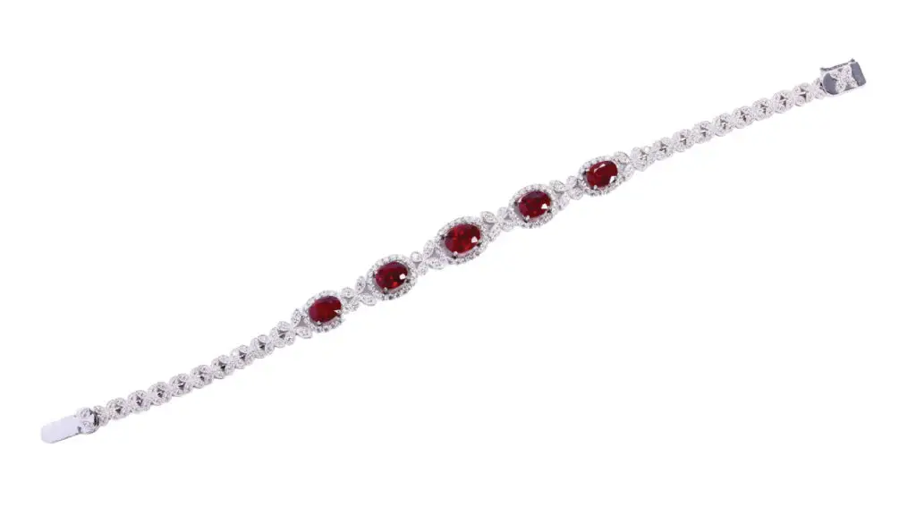 A bracelet sporting five cushion and oval Burmese rubies totaling 5.17 carats, and circular-cut diamonds at Poly Auction image