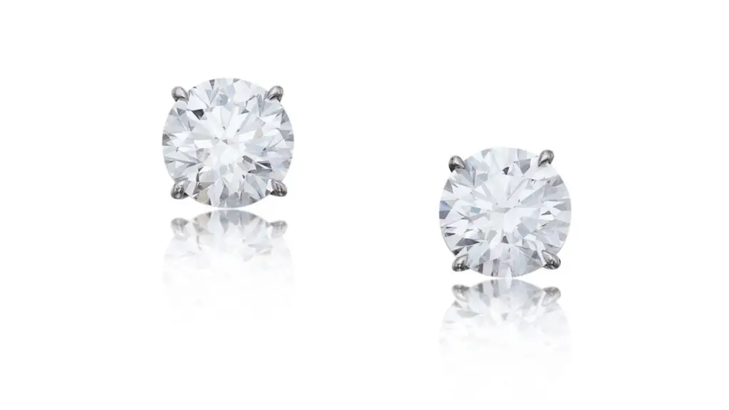 These earrings feature two round, D-color diamonds, one a VVS2 stone weighing 3.20 carats, and the other a 3.33-carat VVS1 at Sotheby's image