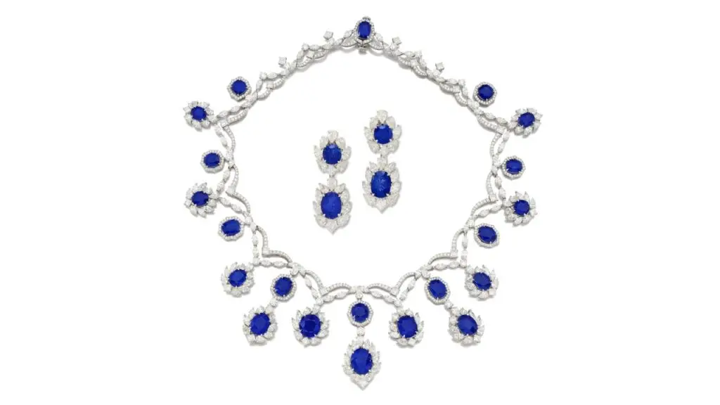 This sapphire and diamond demi-parure comprises a necklace with cushion-shaped and oval Burmese sapphires, ranging from 1.96 to 10.08 carats, within a frame of pear, marquise, princess and brilliant diamonds, as well as a pair of pendant earrings with detachable surmounts at Sotheby's image