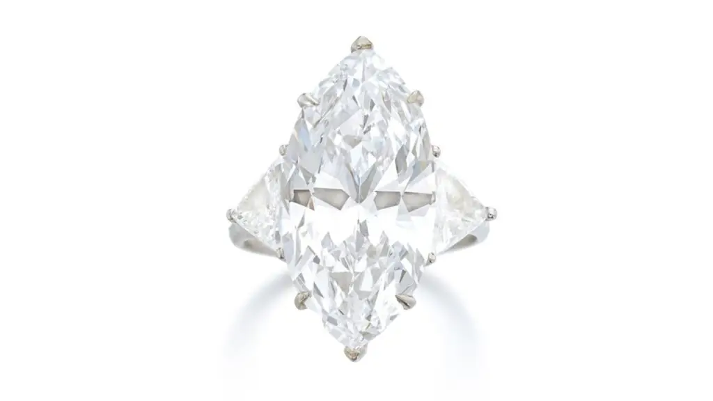 This Graff ring has a marquise-shaped, 10.04-carat, D-color, VVS2-clarity center stone between triangular diamond shoulders at Sotheby's image