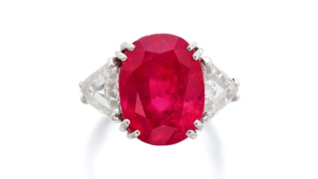 This ring is set with a cushion-shaped, 12.78-carat Burmese ruby between triangular diamonds at Sotheby's image