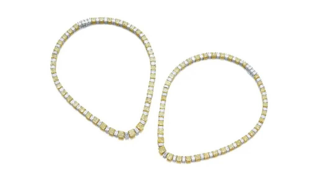 These two Schreiner necklaces are both designed as a graduated row of diamonds. These include cut-cornered, round-cornered square and rectangular modified brilliant-cut fancy-yellow diamonds and diamonds with a yellow tint, alternating with step-cut diamonds. The largest fancy-yellow stone weighs 1.02 carats and is of SI1-clarity at Sotheby's image