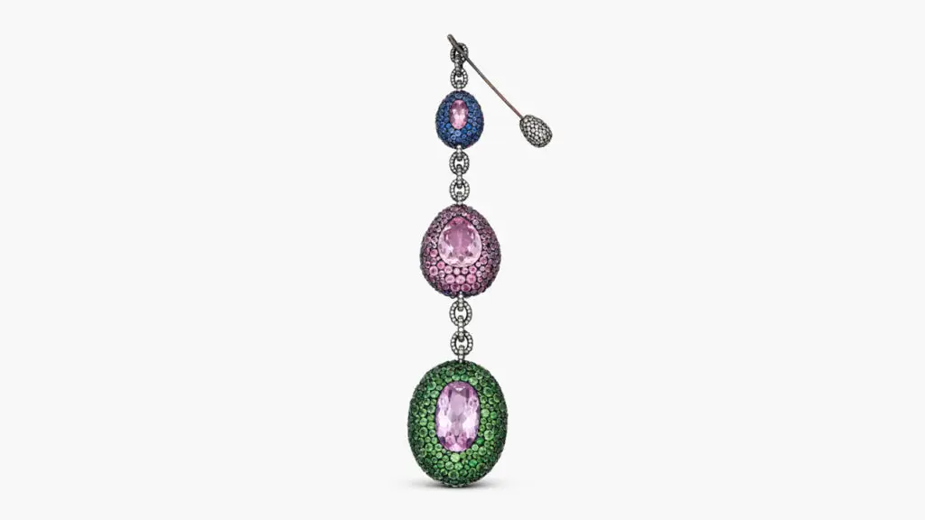 This reversible pendant, which also serves as a brooch, features oval- and pear-shaped pink topazes, as well as round rubies, diamonds, amethysts, sapphires, pink tourmalines, and demantoid garnets at Sotheby's image
