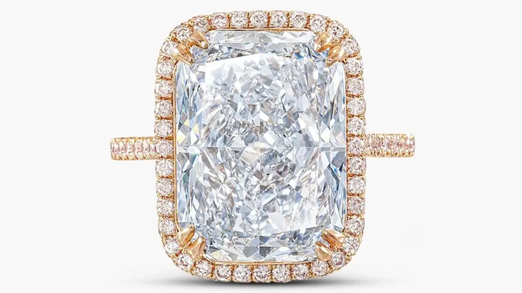 This ring features a cushion-shaped, 7.63-carat, fancy-blue, VVS1-clarity diamond in a surround of brilliant-cut diamonds with a pink tint by Sotheby's image