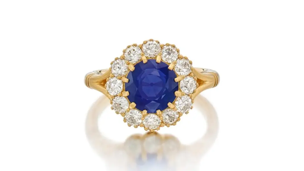 Ring sporting a circular-cut, 3.49-carat Kashmir sapphire within a surround of old mine- and old European-cut diamonds at Sotheby's image