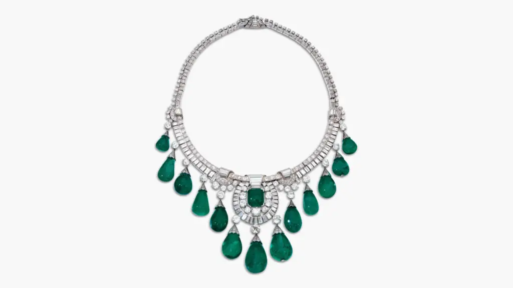 This necklace features a graduated fringe of 13 drop-shaped Colombian emeralds weighing between 11.38 and 57.82 carats, centering an 11.76-carat cabochon Colombian emerald at Sotheby's image