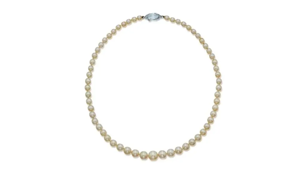 A necklace comprising 59 graduated round and almost round natural pearls with a clasp featuring a marquise-shaped, 3.78-carat, fancy-blue, VS1 diamond at Sotheby's image