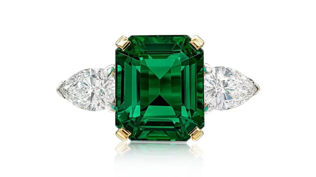 This ring from Cartier centers a step-cut, 4-carat Colombian emerald between two pear-shaped diamonds at Sotheby's image