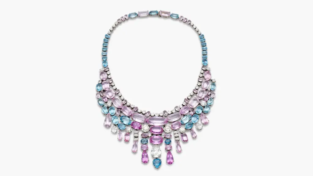 Suzanne Belperron designed this 1966 bib necklace. It contains oval-, pear-shaped and cushion-cut pink topazes and morganites, oval-, pear- and half-moon-shaped aquamarines, and marquise, pear, old European-cut and round diamonds at Sotheby's image