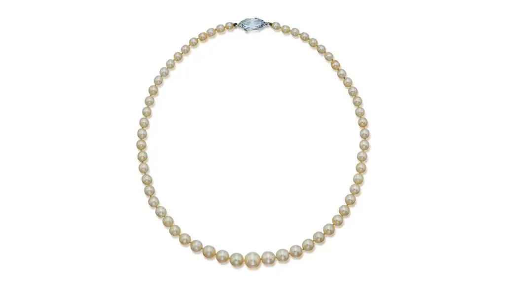 This necklace consists of 59 graduated round to near-round pearls, with a marquise-shaped, 3.78-carat, fancy-blue, VS1 diamond on the clasp at Sotheby's image