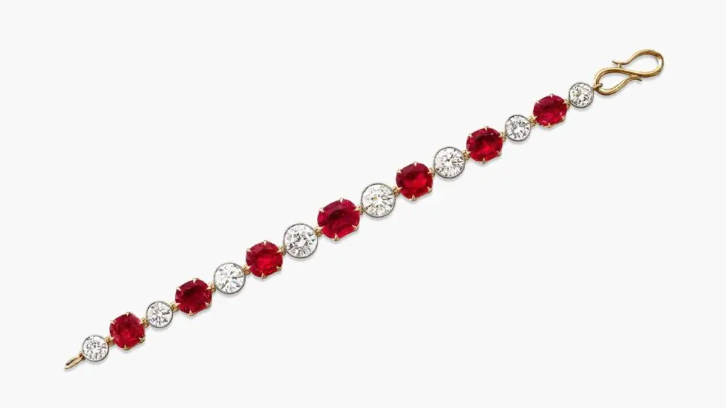 A bracelet featuring a line of seven graduating oval and cushion-shaped Burmese pigeon’s blood rubies weighing 3.73, 3.25, 3.15, 3.15, 3, 2.84 and 2.56 carats, spaced by brilliant-cut diamonds Sotheby's image