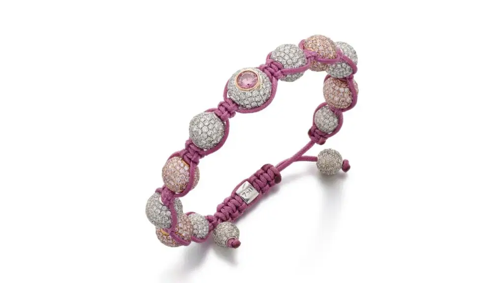 This La Serlas bracelet features a row of alternating spheres with brilliant-cut diamonds and diamonds of pink tint, and a collet-set brilliant-cut 0.66-carat, fancy-intense-purplish-pink, I1 diamond from Rio Tinto’s Argyle mine at Sotheby's image