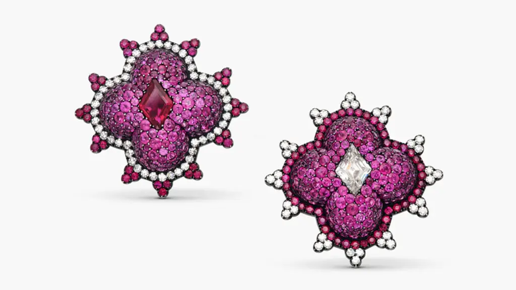 These quatrefoil earrings by JAR are pavé-set with round and kite-shaped rubies and diamonds at Sotheby's image