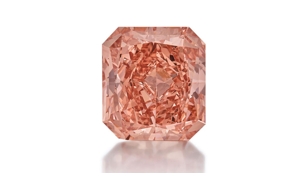 This ring with a cut-cornered rectangular modified brilliant-cut, 3.27-carat, fancy-vivid-orangy-pink, VVS1 diamond at Sotheby's image