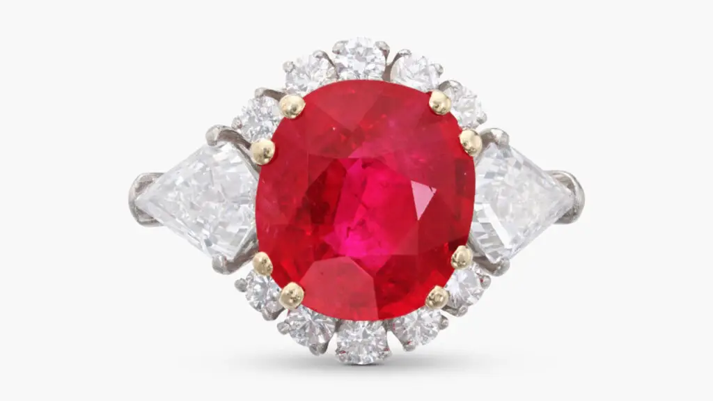 Made by Van Cleef & Arpels, this ring centers a cushion-shaped, 6.51-carat Burmese ruby inside a brilliant-cut diamond surround at Sotheby's image