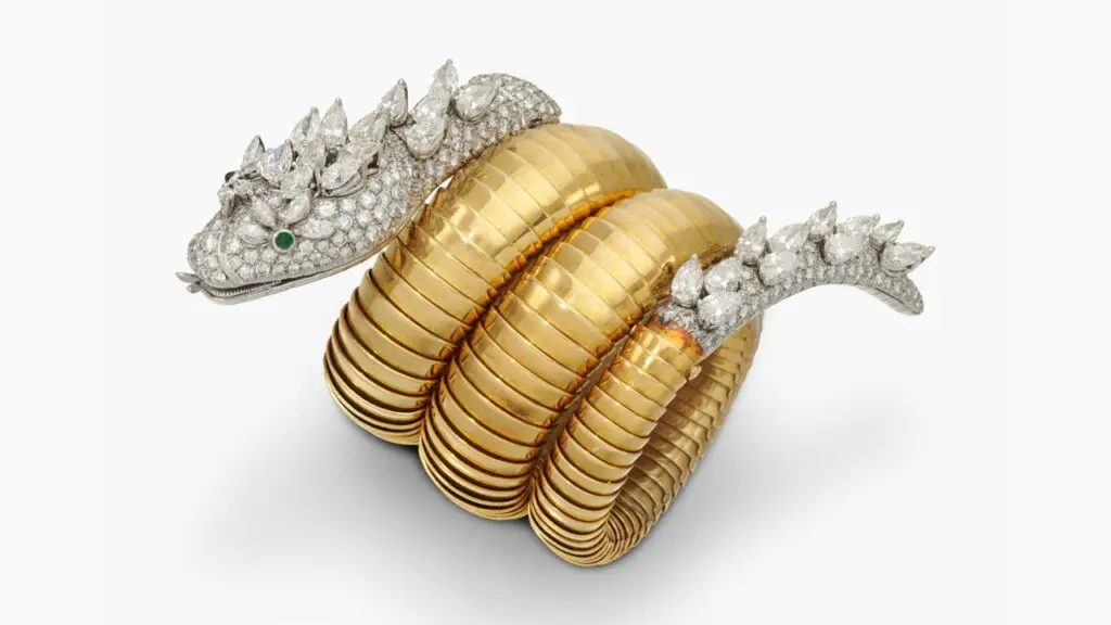Formerly belonging to the wife of Italian entrepreneur Romeo Invernizzi, this Bulgari Serpenti wristwatch, designed as a coiling serpent, has a head and tail containing pear-shaped and brilliant-cut diamonds, along with cabochon emerald eyes at Sotheby's image