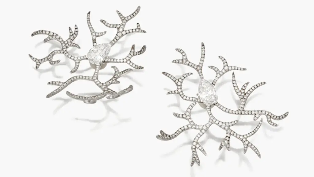 These JAR earrings, designed to resemble frost, feature diamond-set branches radiating from pear-shaped diamonds at Sotheby's image