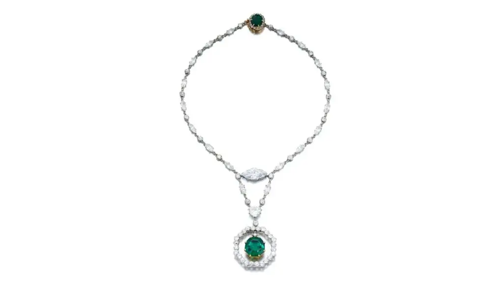 Cartier created this necklace, which bears an octagonal step-cut Colombian emerald weighing 11.78 carats, surmounted by an old mine-cut diamond, swing-set within an old European-cut diamond frame. The necklace also contains a marquise-shaped diamond weighing 5.54 carats and a heart-shaped, 3.12-carat diamond, as well as a cushion-shaped, 2.64-carat emerald at Sotheby's image