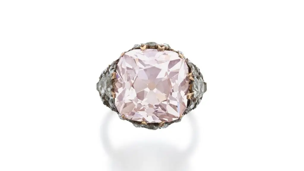This ring contains an old mine brilliant-cut, 13.86-carat, light-pink, VS2-clarity diamond, and old mine- and rose-cut embellishments at Sotheby's image