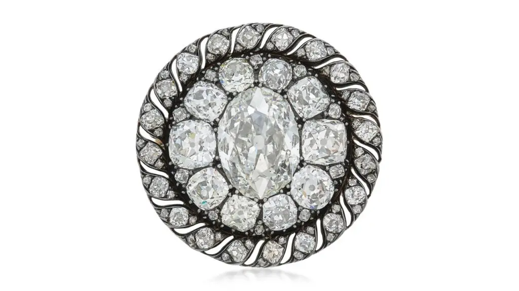 This brooch, which also functions as a pendant, has an oval diamond weighing 13.04 carats in an old mine- and mazarin-cut diamond surround at Sotheby's image