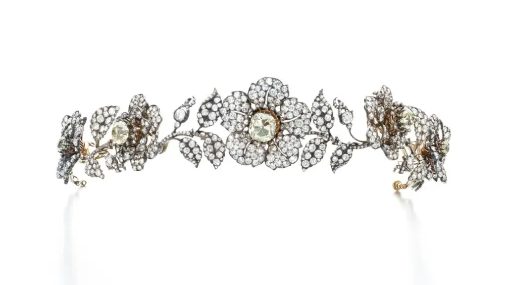 A diamond tiara designed as a garland of wild roses can be transformed into five brooches and two pairs of ear clips. Created around 1840. At Sotheby's image