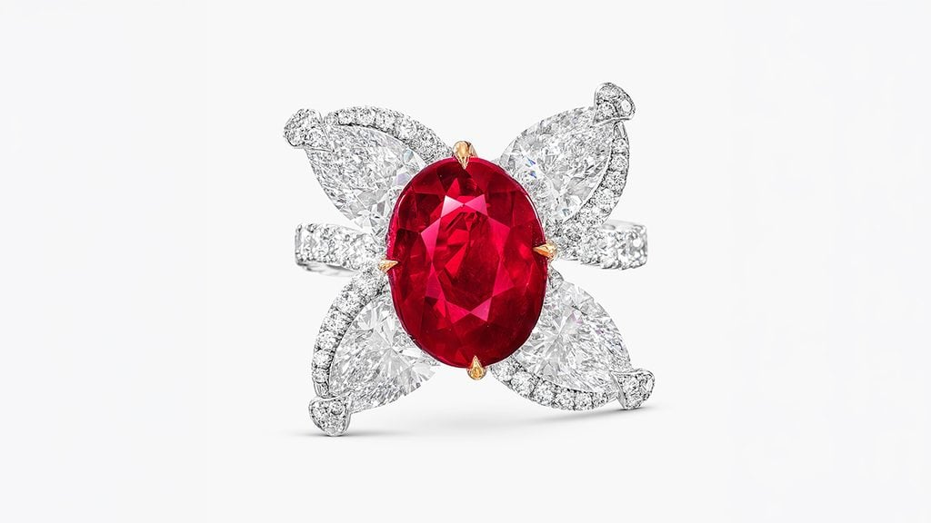 A ring centering an oval, 5.06-carat Burmese ruby adorned with pear-shaped and brilliant-cut diamonds weighing around 5 carats, in H to I color and VS to SI clarity at Sotheby's image