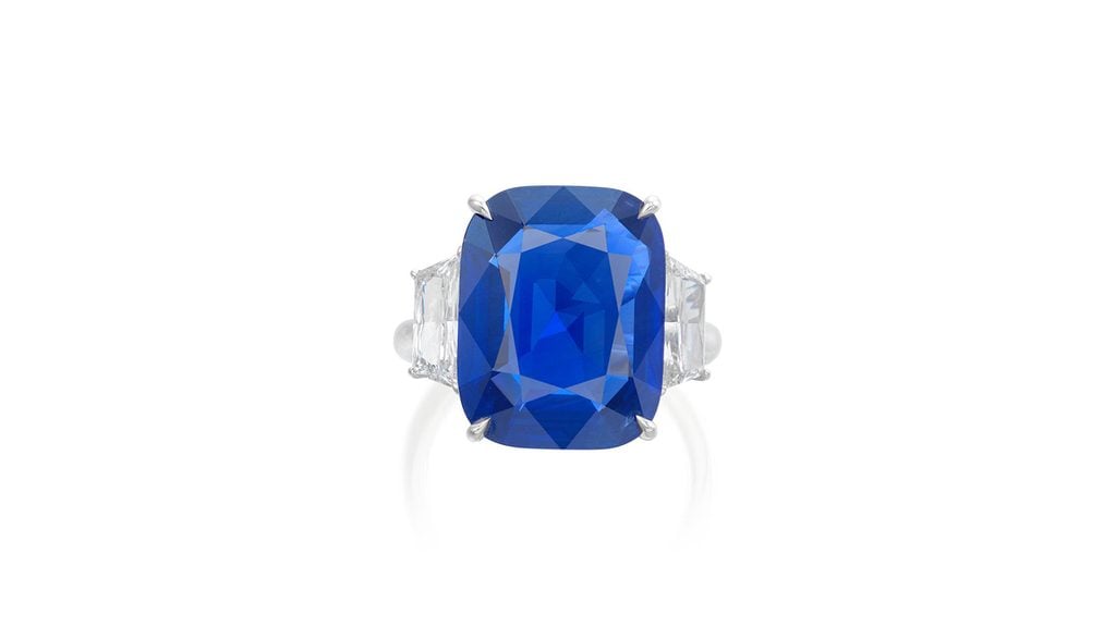 The auction house is offering a ring with a cushion-shaped, 13.82-carat Burmese sapphire, between two trapezoid modified brilliant-cut diamonds at Phillips image