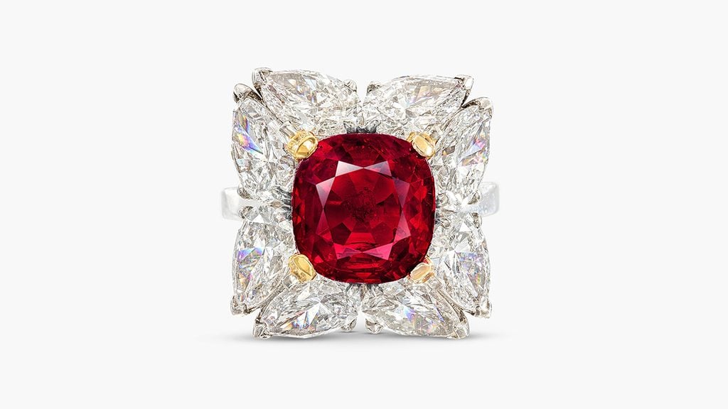 A ring set with a cushion-shaped, 6.05-carat Burmese ruby in a surround of eight pear-shaped diamonds at Sotheby's image