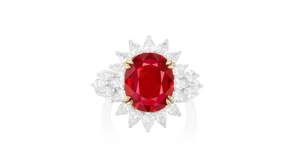 This ring bears an oval, Mozambican ruby weighing 6.06-carats, in a pear- and marquise-shaped diamond surround and brilliant-cut diamond shoulders at Phillips image