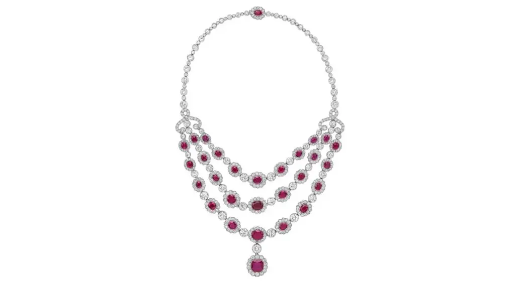 Necklace sporting a ruby pendant and three rows of graduated oval-shaped Burmese rubies, with each stone in a circular-diamond surround at Bonhams image