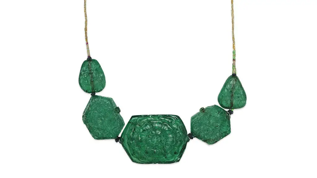 Necklace from around 1750 featuring five carved Colombian emeralds — three hexagonal and two pear-shaped, from the Mughal collection, at Christie's image