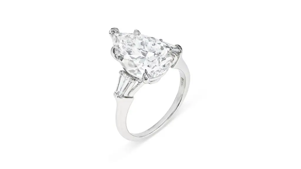 Harry Winston ring bearing a pear brilliant-cut diamond and tapered baguette-cut diamond side stones at Christie's image.