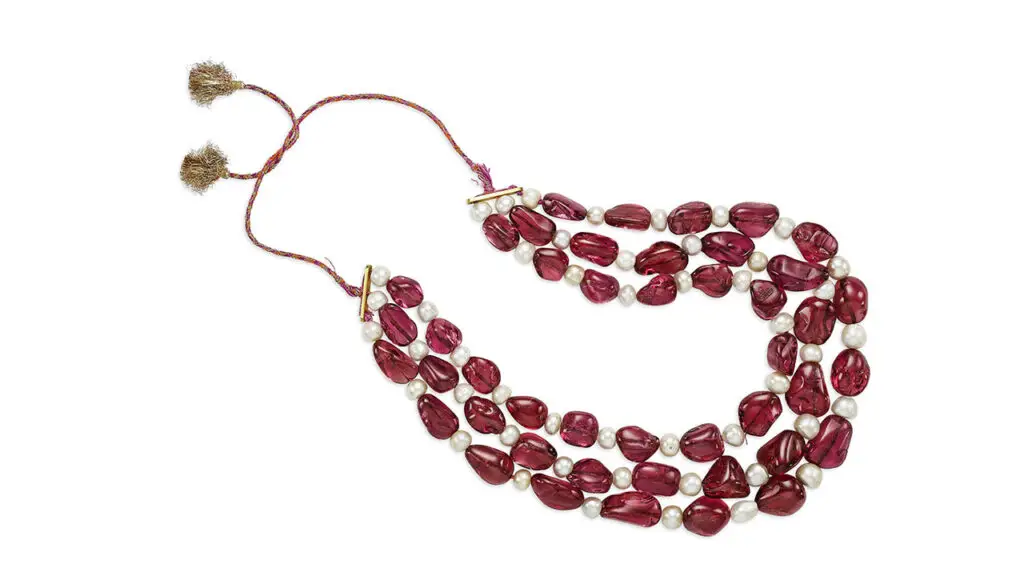 Three-strand necklace comprising 45 spinel beads and 48 round and near-round natural pearls, from the Mughal collection, at Christie's image