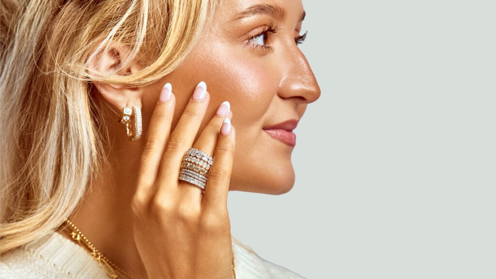 A model wears a selection of Carter’s Collective wedding bands image