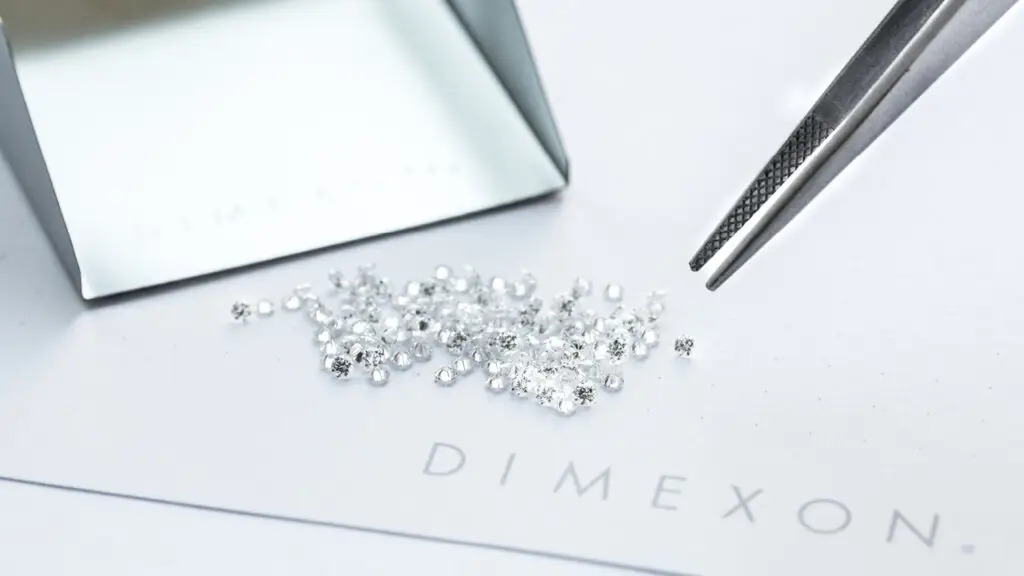 Dimexon diamonds being sorted with a pair of tweezers image
