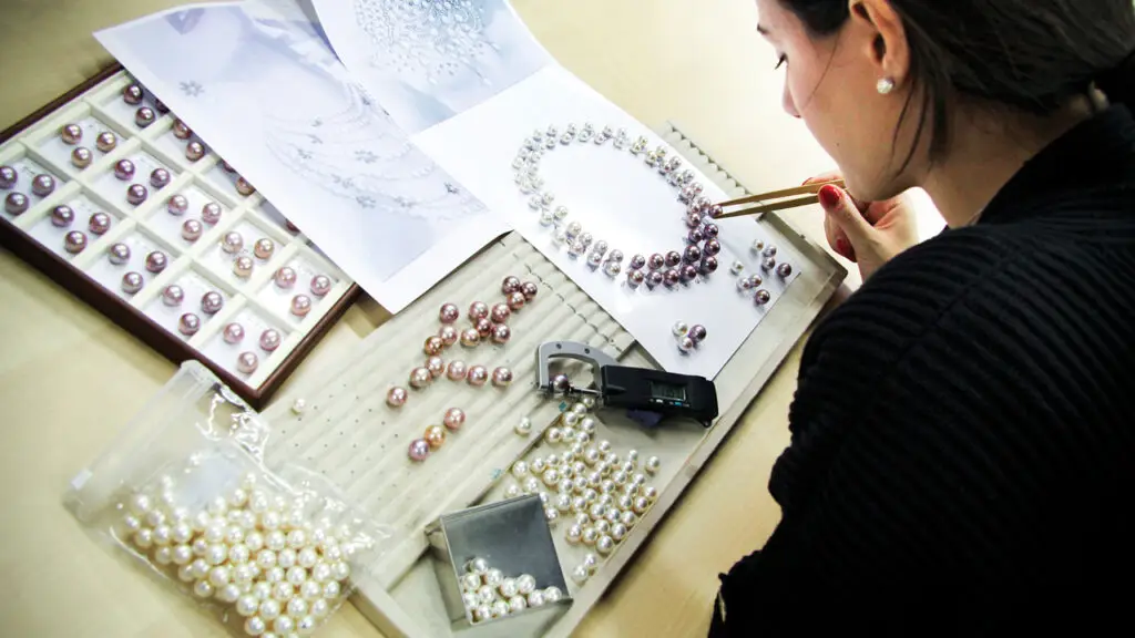 Yoko London designer planning out a necklace image