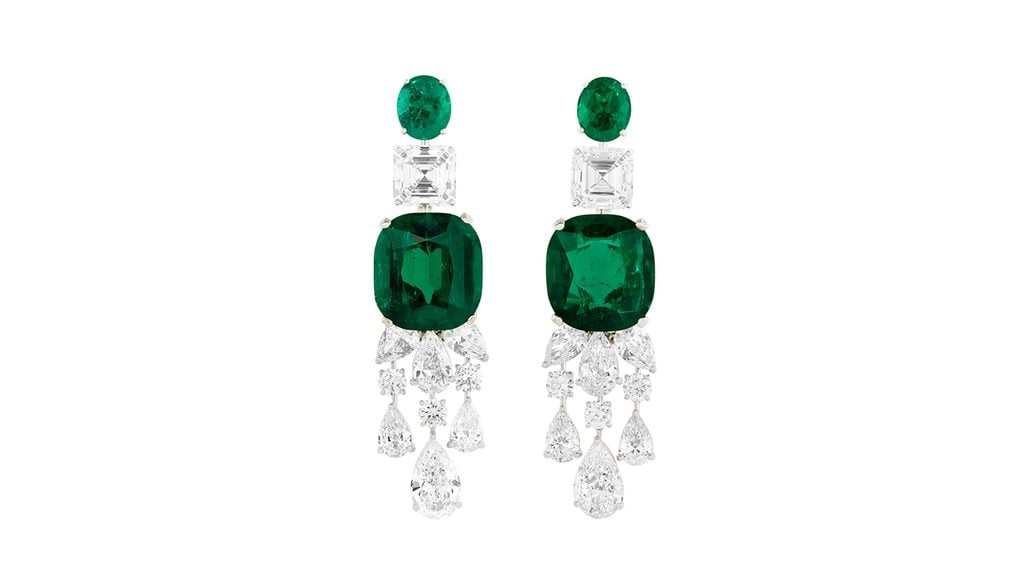 A pair of Graff earrings, each bearing a cushion-shaped emerald exceeding 17 carats as well as diamonds at Christie's image