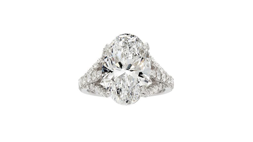 A Carvin French ring centering an oval-shaped, 7.02-carat, D, SI1 diamond with full-cut stones along the band at Heritage Auction image