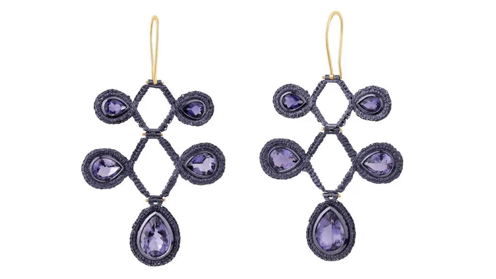 Ebba Goring’s Regency chandelier earrings, feature pear-cut iolites in silver with a twilight-blue nano-ceramic coating image
