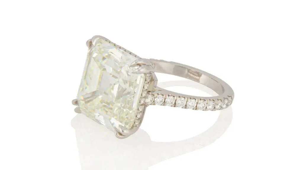 Ring features a square emerald-cut, 15.57-carat diamond, accented by round diamonds on the band by John Moran image