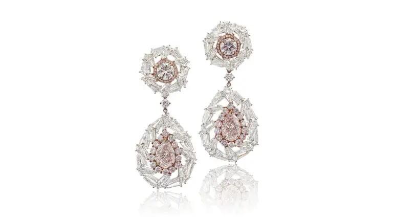 The pair of colored-diamond earrings at Sotheby's image