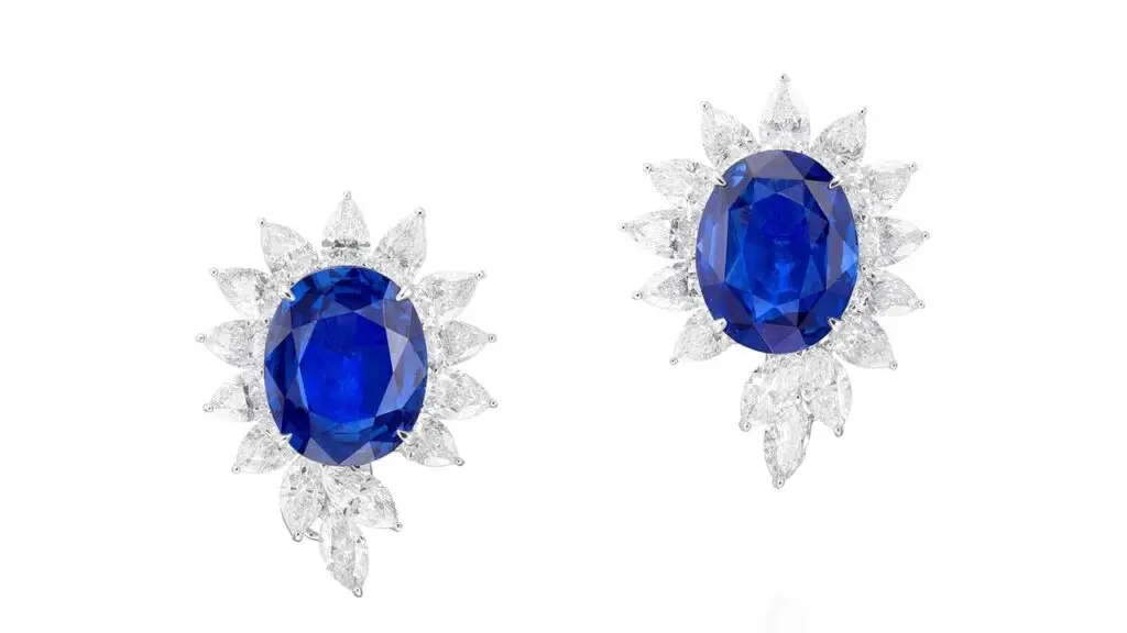 Pair of earrings featuring oval sapphires surrounded by pear- and marquise-shaped diamonds at Phillips image