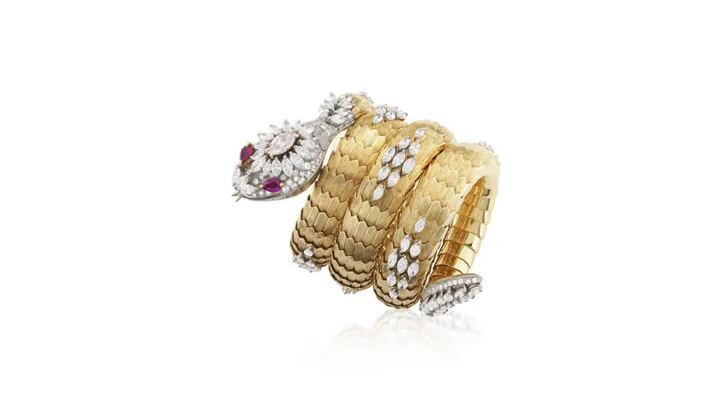 Serpenti wristwatch by Bulgari featuring rubies, diamonds and a light-pink diamond at Phillips image