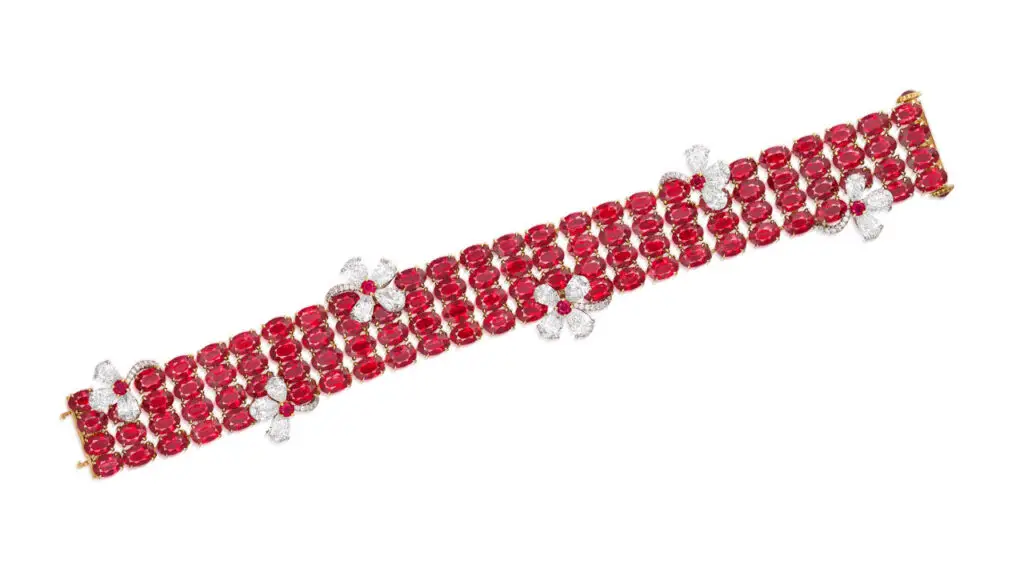 Four rows of approximately 51.86 carats of Burmese rubies adorn this bracelet, which also includes six floral motifs of circular-cut rubies and pear-shaped and brilliant-cut diamonds at Phillips image