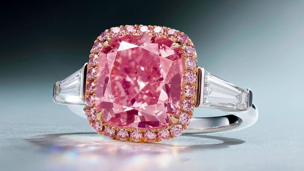 A rectangular-shaped, 3.71-carat, fancy-intense-pink, SI2-clarity is the star of this ring. It’s in a frame of circular-cut, pink diamonds with tapered-baguette diamond side stones at Poly Auction image
