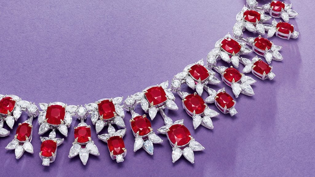 A necklace featuring oval and cushion-cut Burmese rubies with a total weight of 50.37 carats, each framed by pear, marquise and circular-cut diamonds at Poly Auction image
