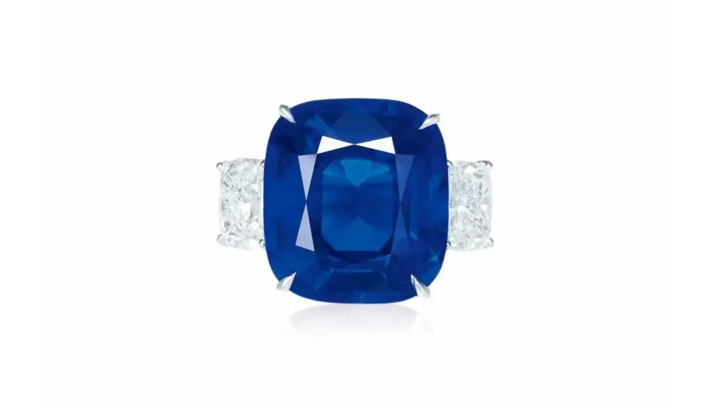 Cushion-shaped Madagascan sapphire with diamond side stones at Poly Auction image