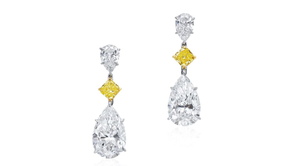Pair of diamond earrings at Poly Auction image
